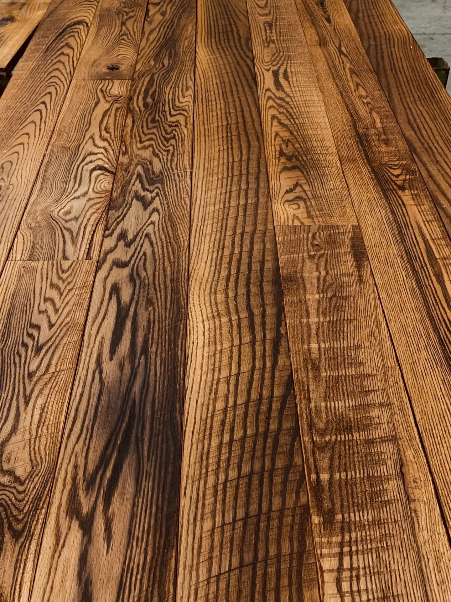 Close-up of weathered wooden planks with rich brown grain patterns.