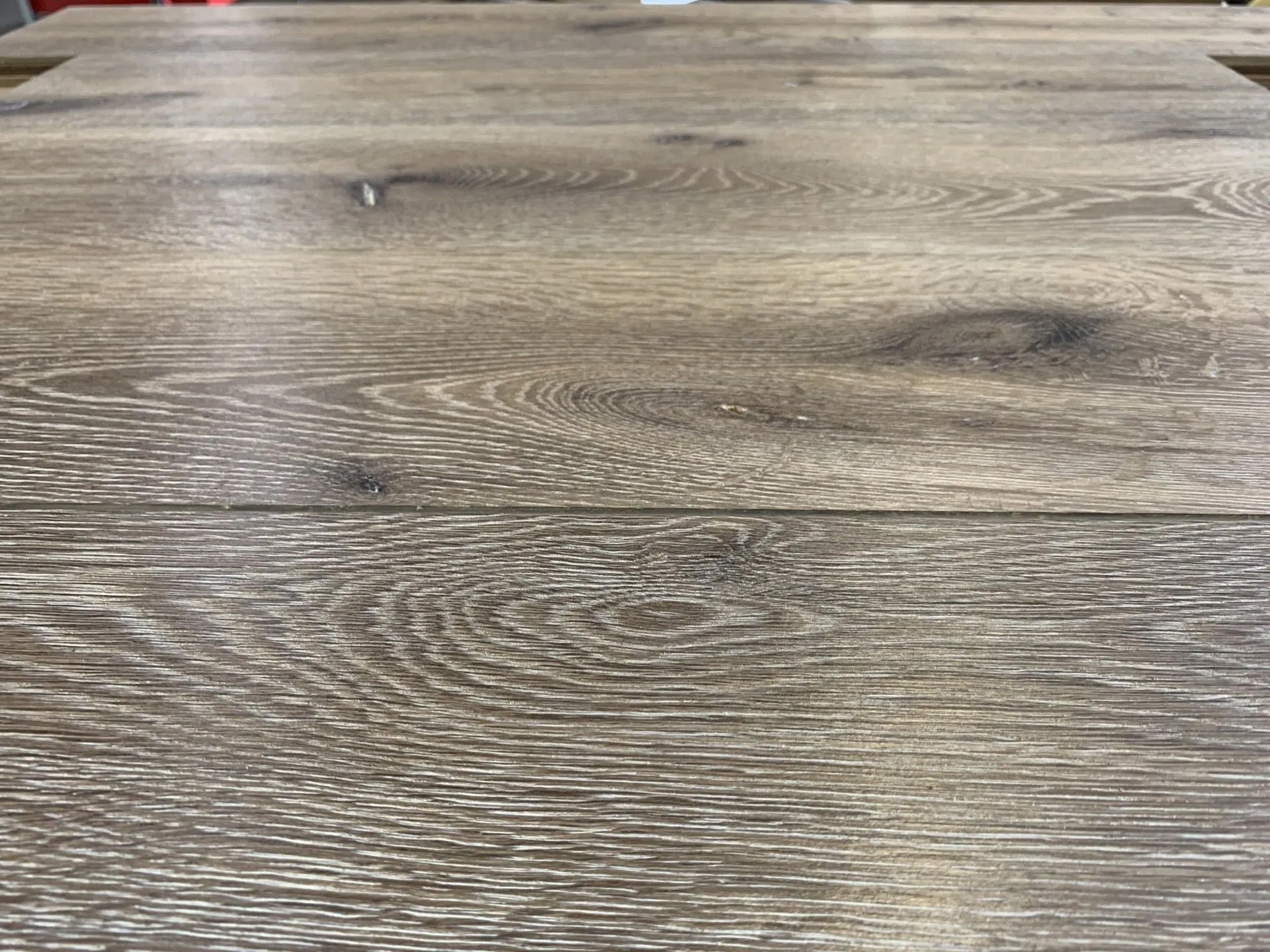 Close-up of a gray-brown wood grain tabletop surface