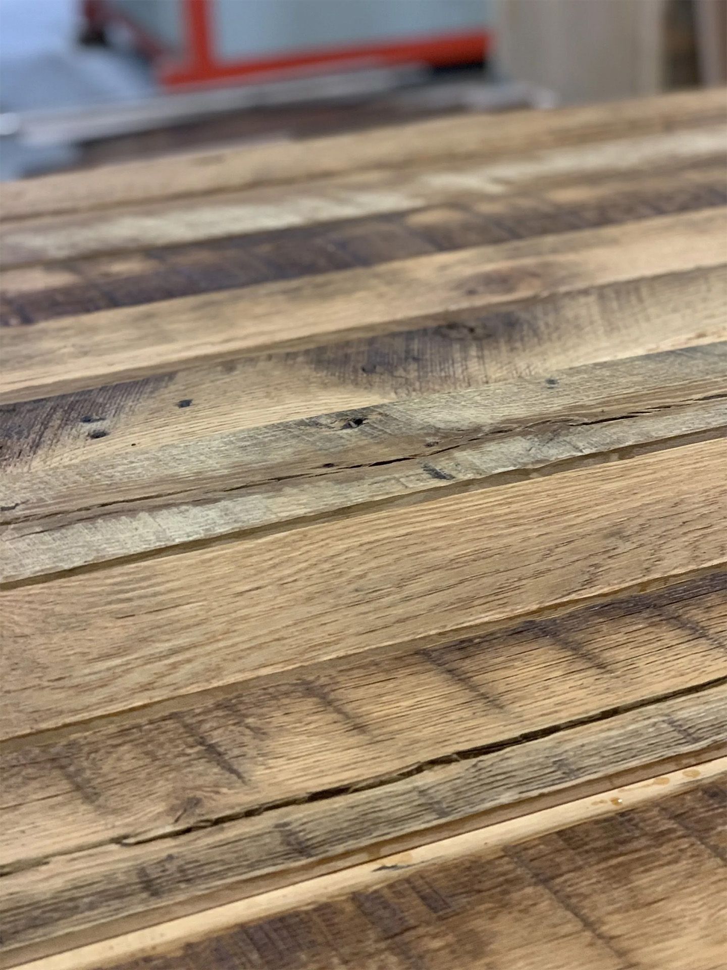 Close-up of weathered wooden planks with natural grain and dark stain marks