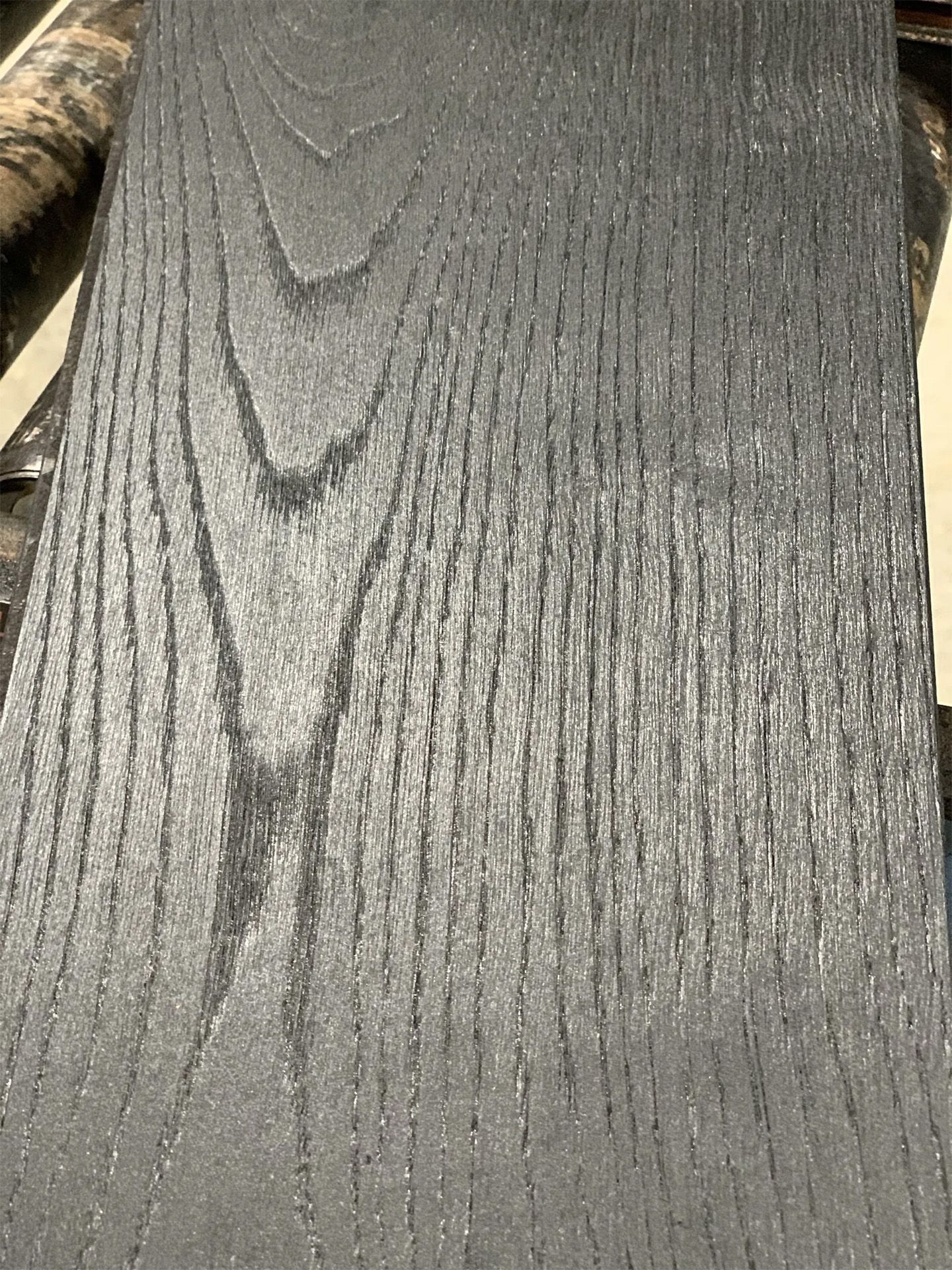Close-up of a gray textured fabric with vertical ribbed pattern
