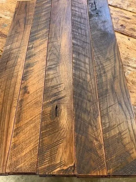 Close-up of rustic wooden planks with warm brown grain and dark streaks
