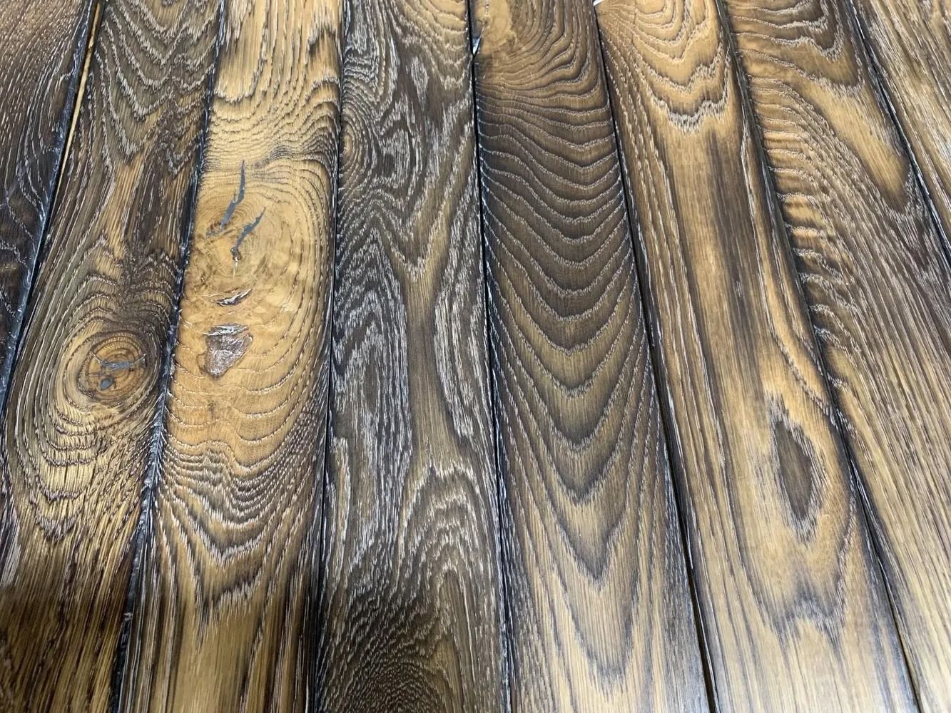 Close-up of textured wood grain with dark and golden streaks
