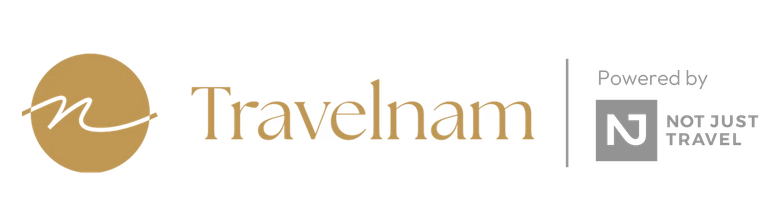 Travelnam logo with gold script and Not Just Travel badge on white background