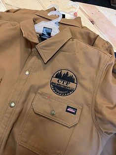 Two brown work shirts with 
