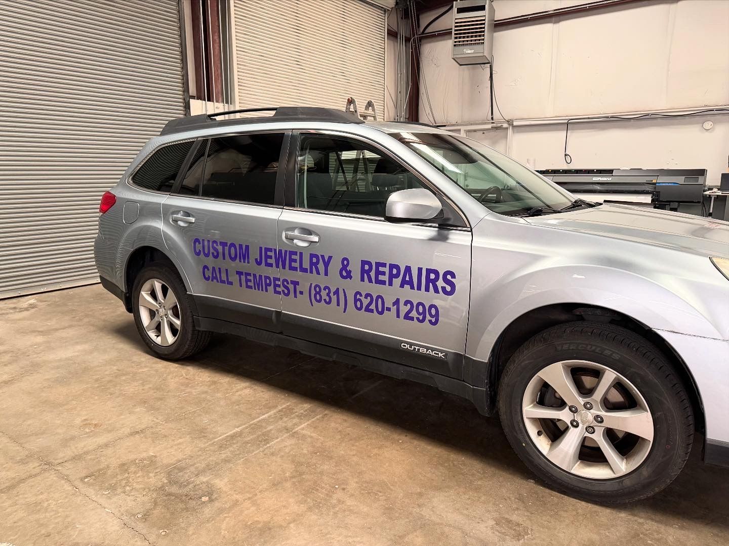 Silver Subaru Outback with 