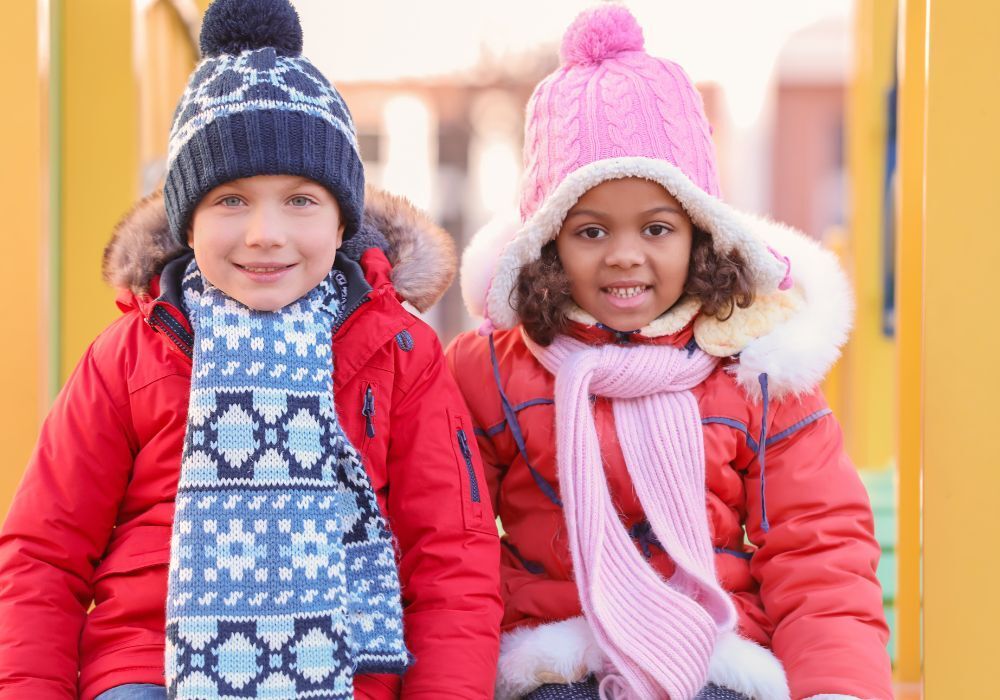 two kids dressed in cute winter gear