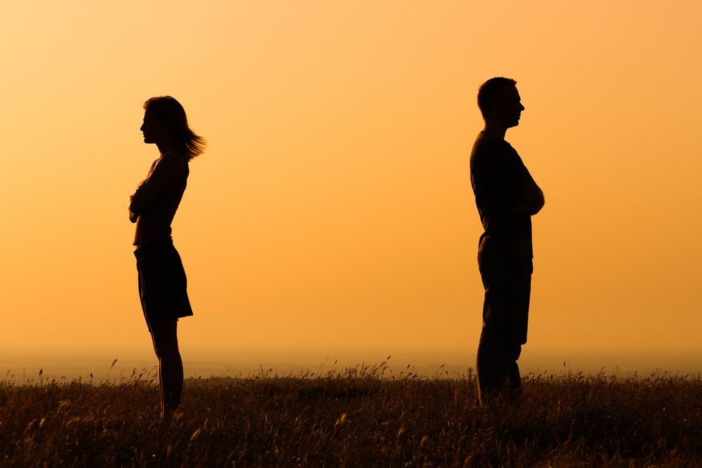 A Man Is Standing in A Field At Sunset — Psych Solutions NT in Leanyer, NT