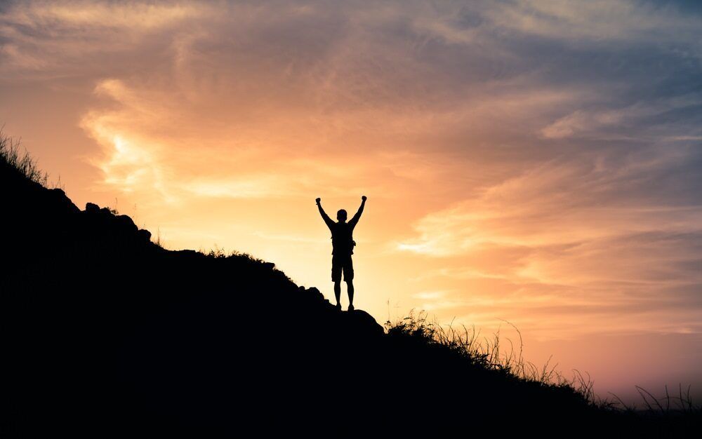 A Man Sillouhette On Top Of Mountain In Front Of Sunset— Psych Solutions NT in Leanyer, NT