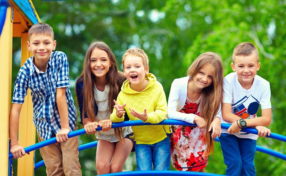 A Group Of Children Are Playing On A Playground — Psych Solutions NT in Leanyer, NT
