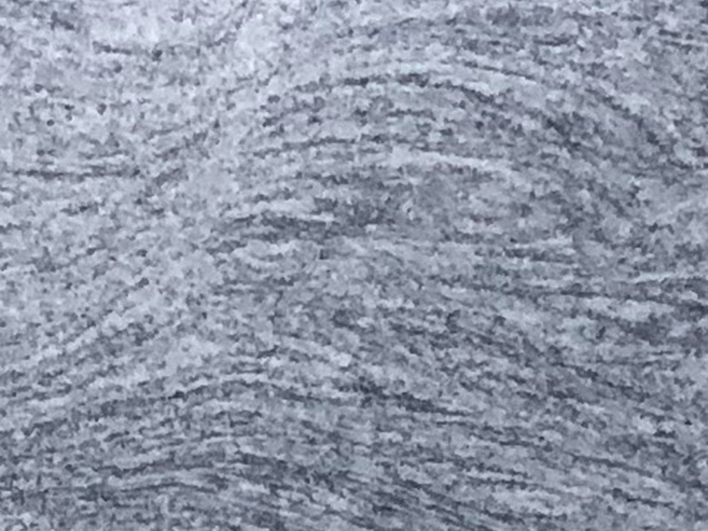 A close-up image of the intricate pattern of Silver Cloud granite, which will be used in the construction of Peace Corps Park