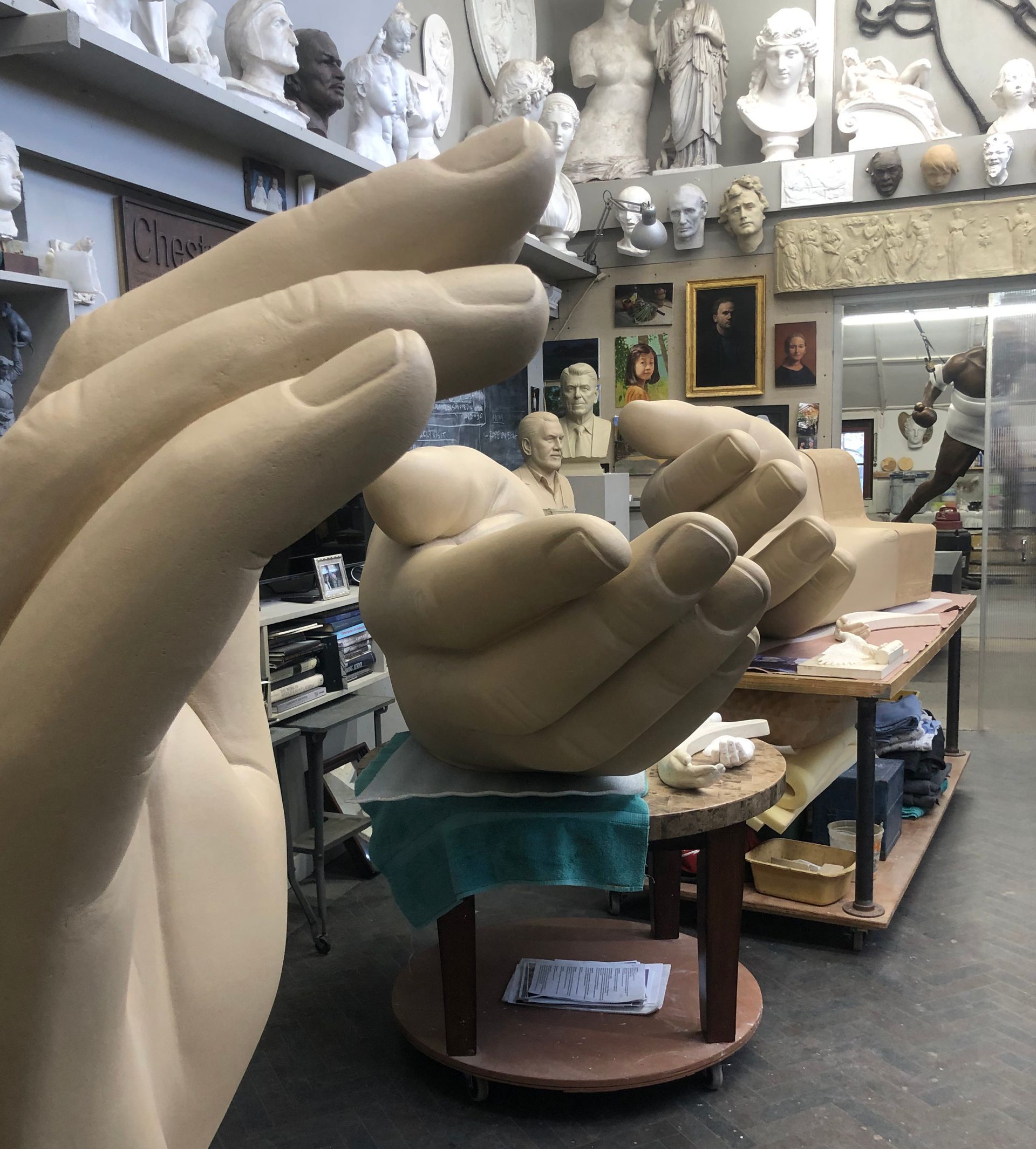 An image of the three plaster scale mockups of the hand forms for Peace Corps Park's benches