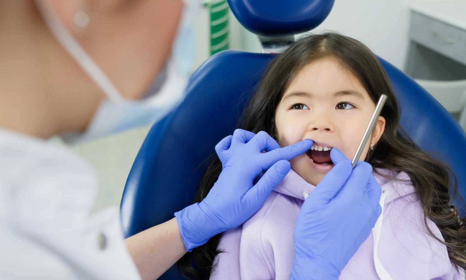 little girl at the dentist