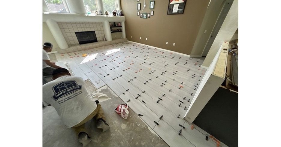Tile floor installation in Valrico Florida living room with large format tile.
