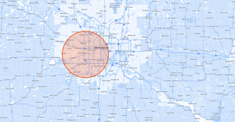 Map with an orange-highlighted circle marking a location in a blue street map Map with an orange-highlighted circle marking a location in a blue street map
