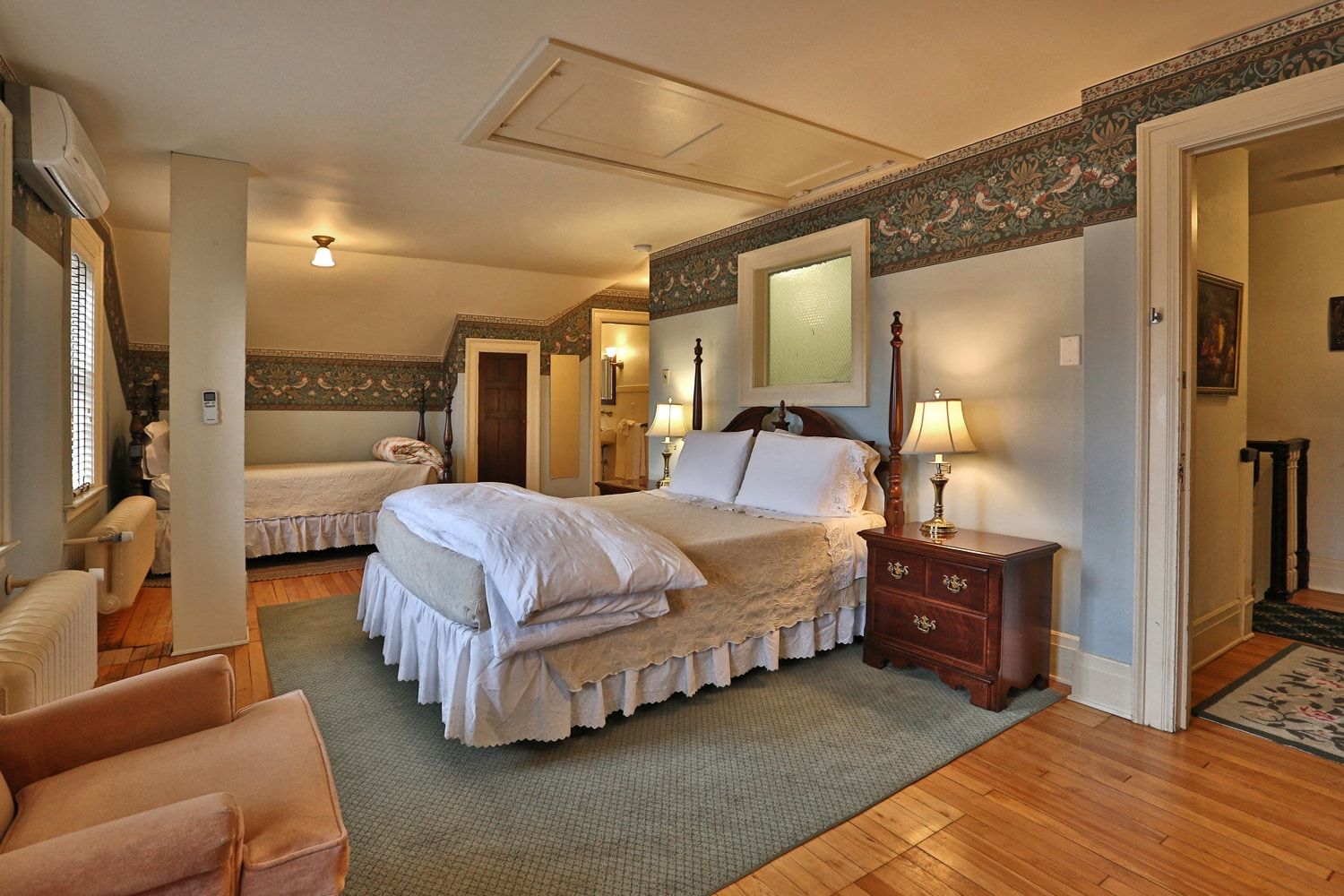 There is a large bed in the middle of the room.