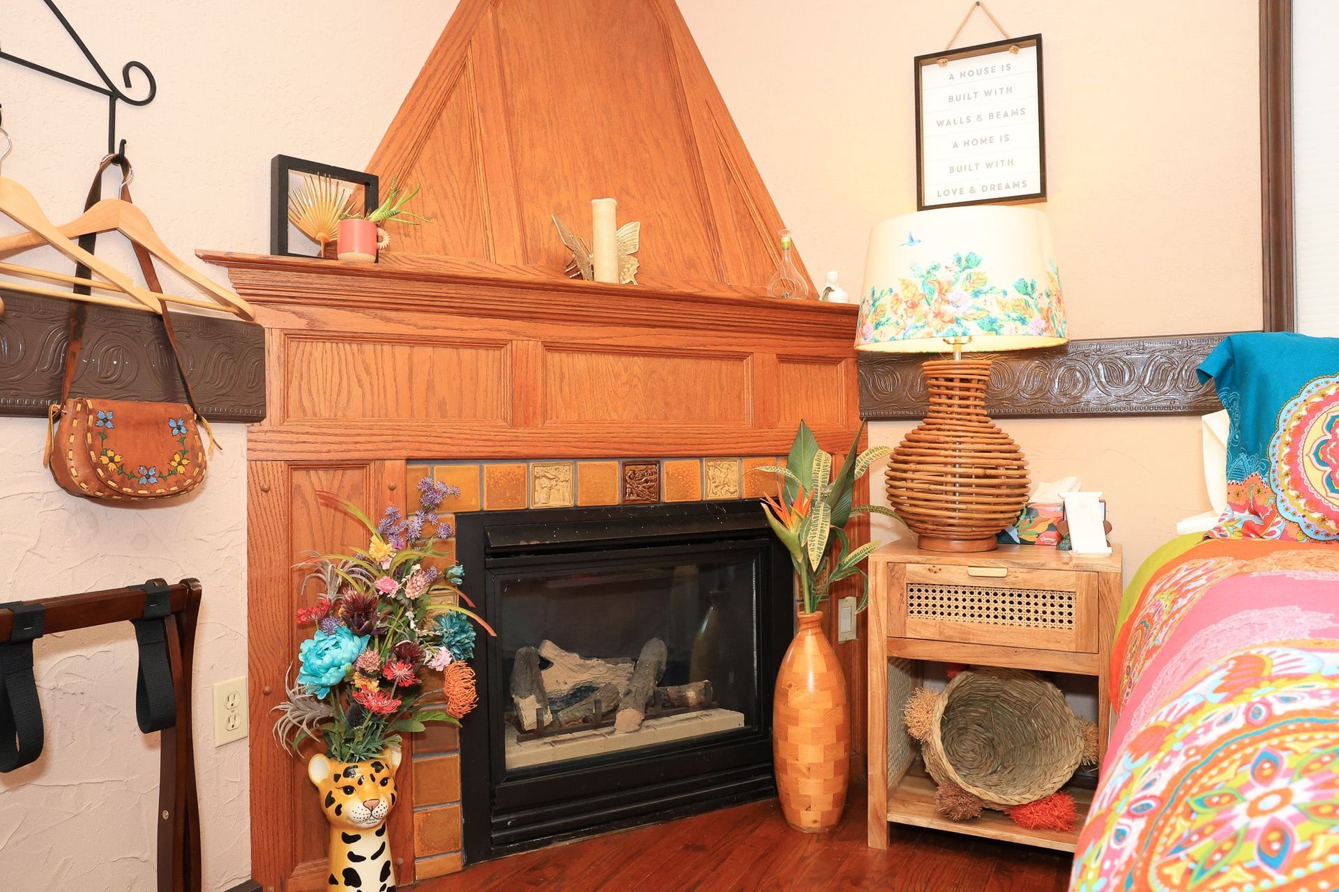 There is a fireplace in the corner of the room.