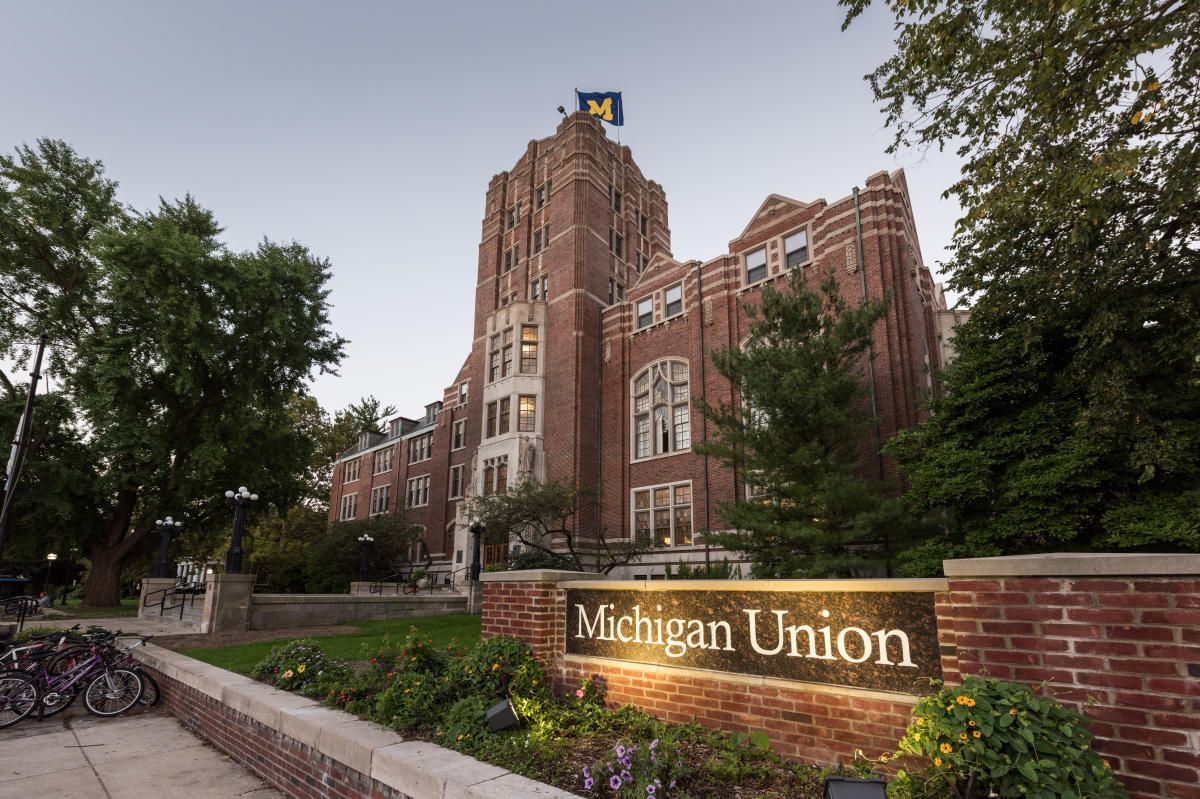 A large brick building with a sign that says michigan union