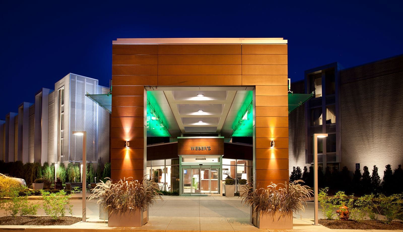 The entrance to a hotel with a green ceiling