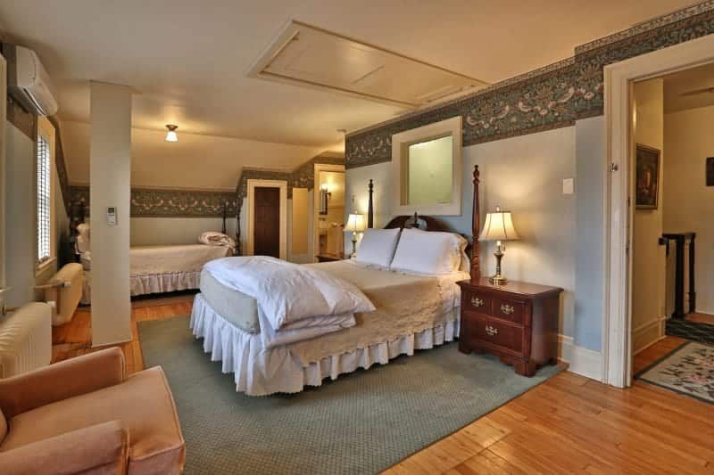 There is a large bed in the middle of the room.