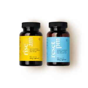 Two supplement bottles, one with a yellow label and one with a blue label, on a white background