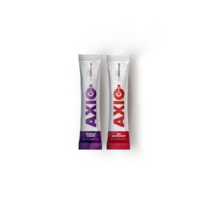 Two AXE deodorant tubes, one purple and one red, standing side by side on a white background