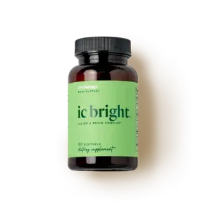 Black supplement bottle with green label reading “ic bright” and black cap on white background