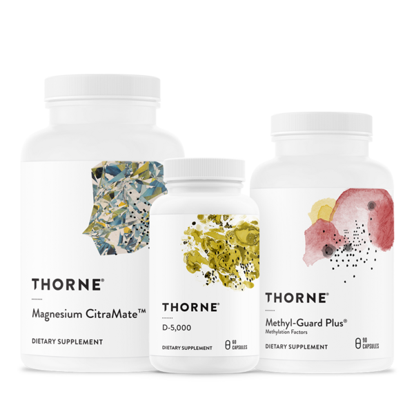 Three Thorne dietary supplement bottles with white labels and colorful botanical accents