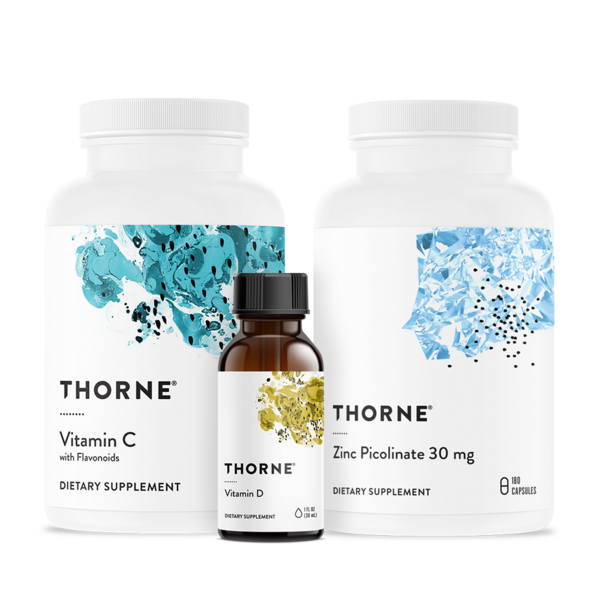 Thorne supplement bottles: vitamin C, zinc picolinate, and phosphatidyl? in white packaging with blue and gold accents