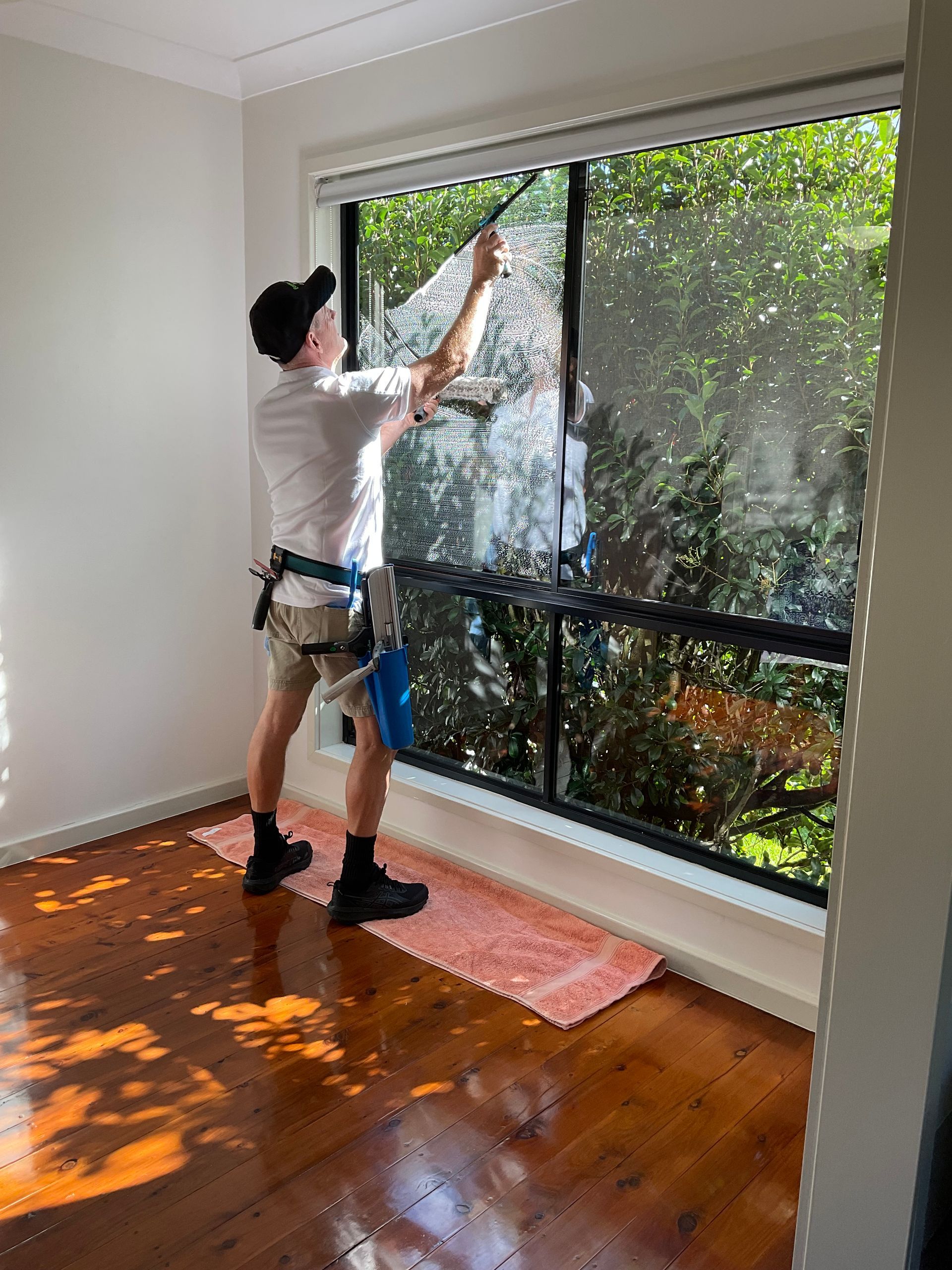 Narrow Backyard Pool Beside a Beige House — Eastons Window Cleaning in Cardiff, NSW