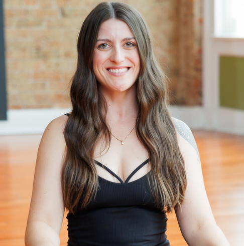 Emilee Hamilton, an empowering yoga instructor who focuses on alignment and foundational techniques in her classes.