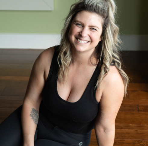 Micaiah Hascher, a 200-hour RYT yoga instructor at Uptown Yoga in Dallas, known for creative sequences and core focus.