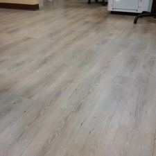 A close up of a wooden floor in a room.
