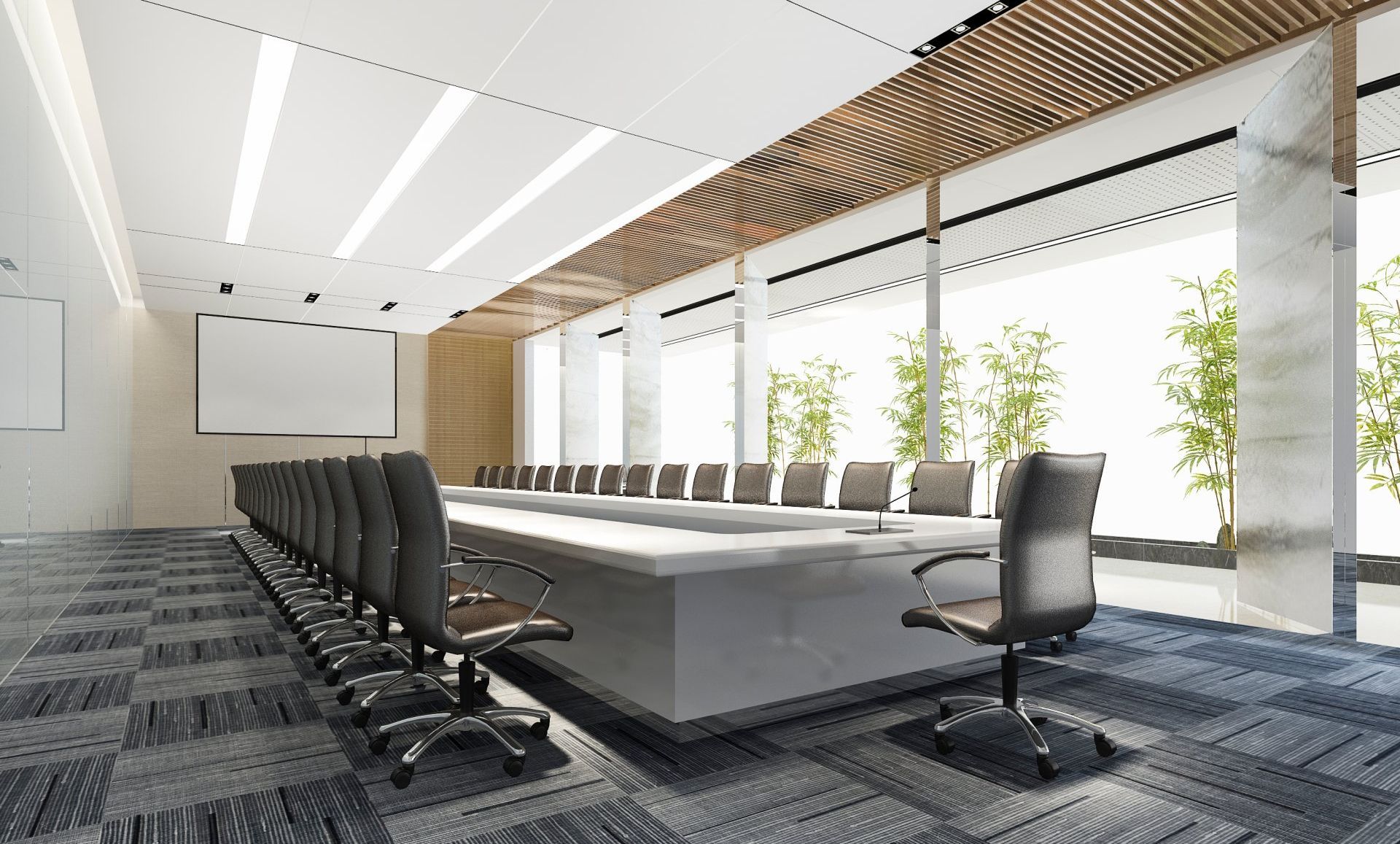 A large conference room with a long table and chairs.