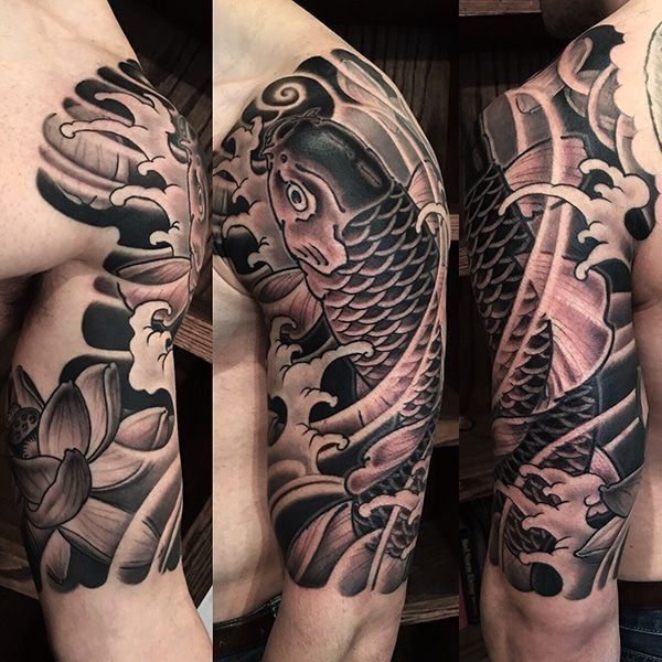 A man has a tattoo of a fish on his arm
