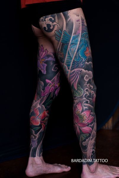 A person with a lot of tattoos on their legs
