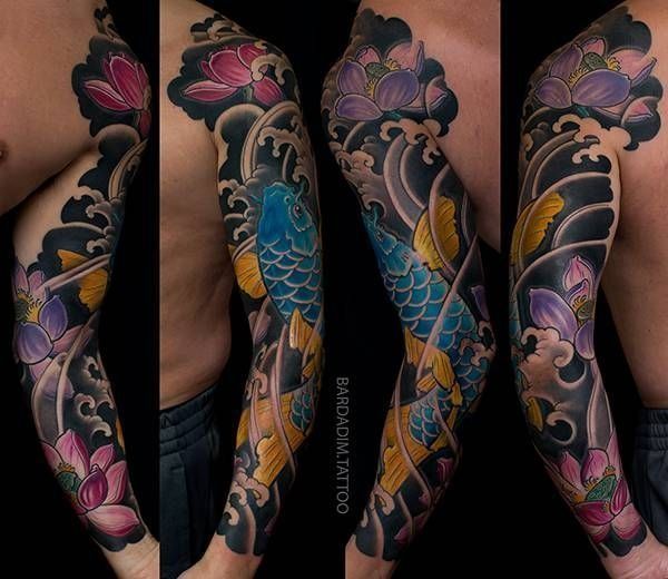 A tattoo of a fish and flowers on a man 's arm