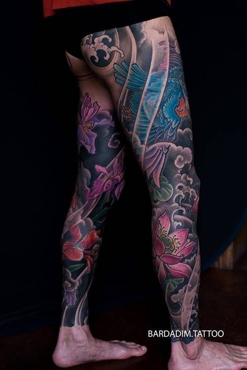 A person with a lot of tattoos on their legs.