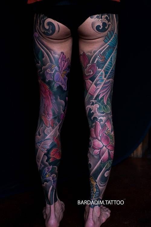 A woman with a lot of tattoos on her legs.