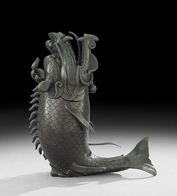 Bronze koi-fish shaped container with open mouth, fins, and scales; Japanese art.