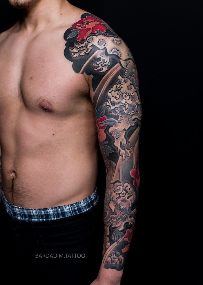 Front view of the shishi pair sleeve showing the male lion with the seven-treasure ball above an open peony.