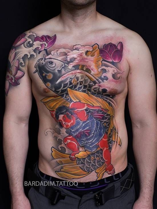 Torso with a large colorful koi fish tattoo across the chest and abdomen