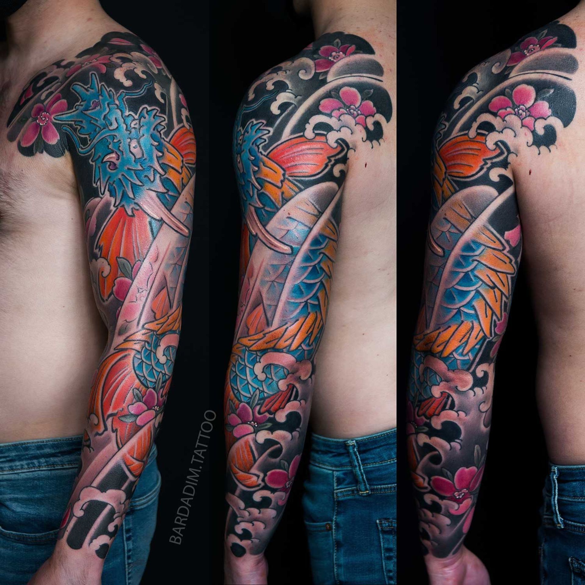 Colorful dragon sleeve tattoo with koi fish and cherry blossoms.