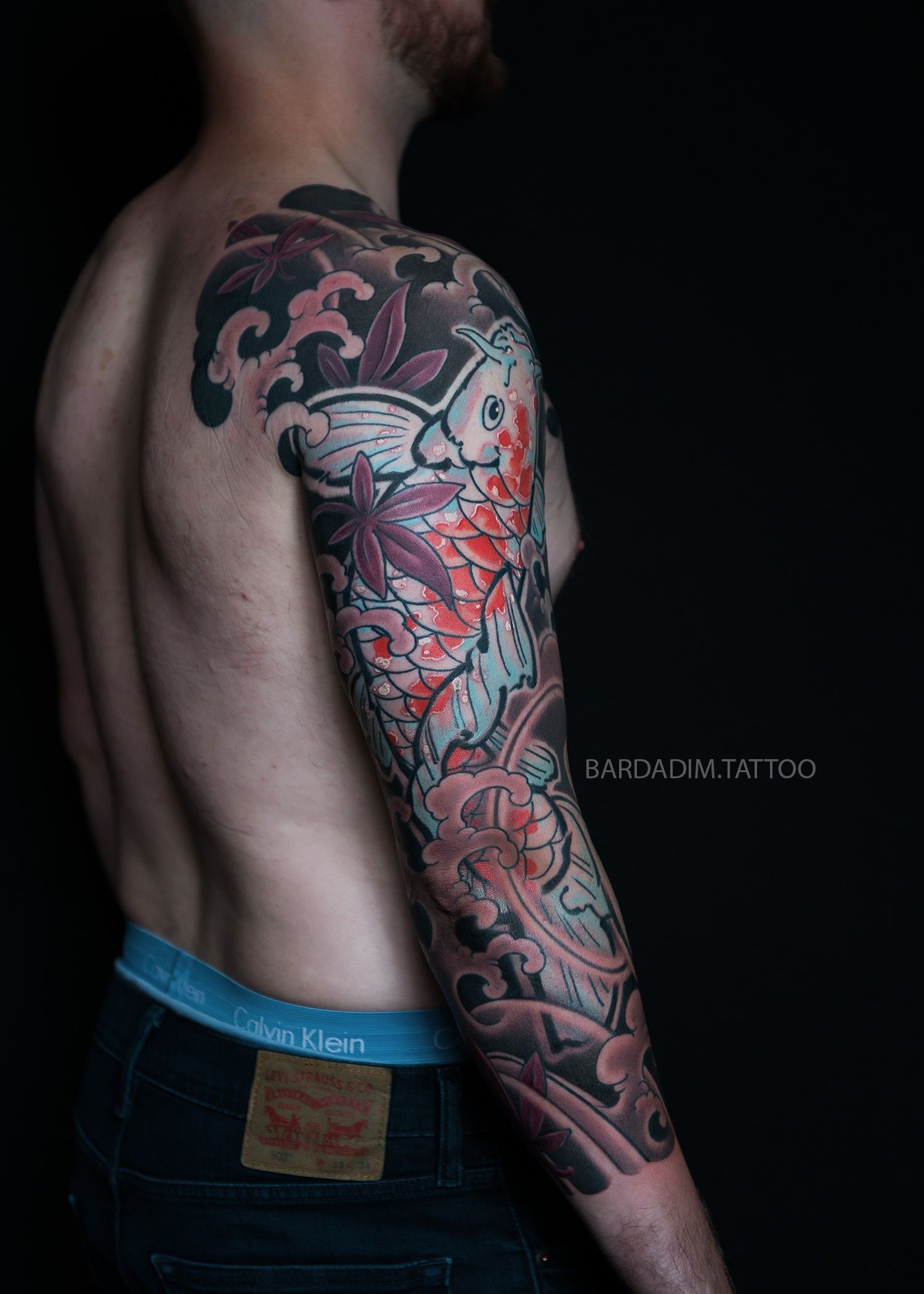 Orange koi Japanese tattoo shoulder and arm composition