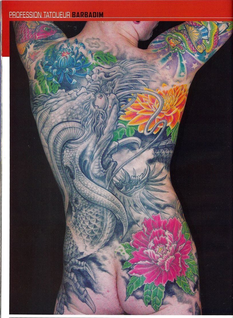 A person with a lot of tattoos on their back