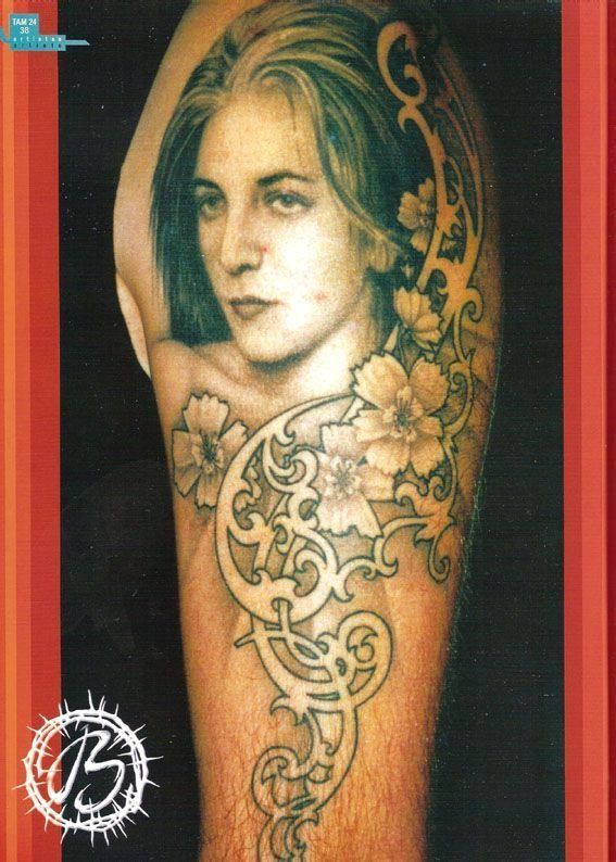 A tattoo of a woman with the letter b on the bottom