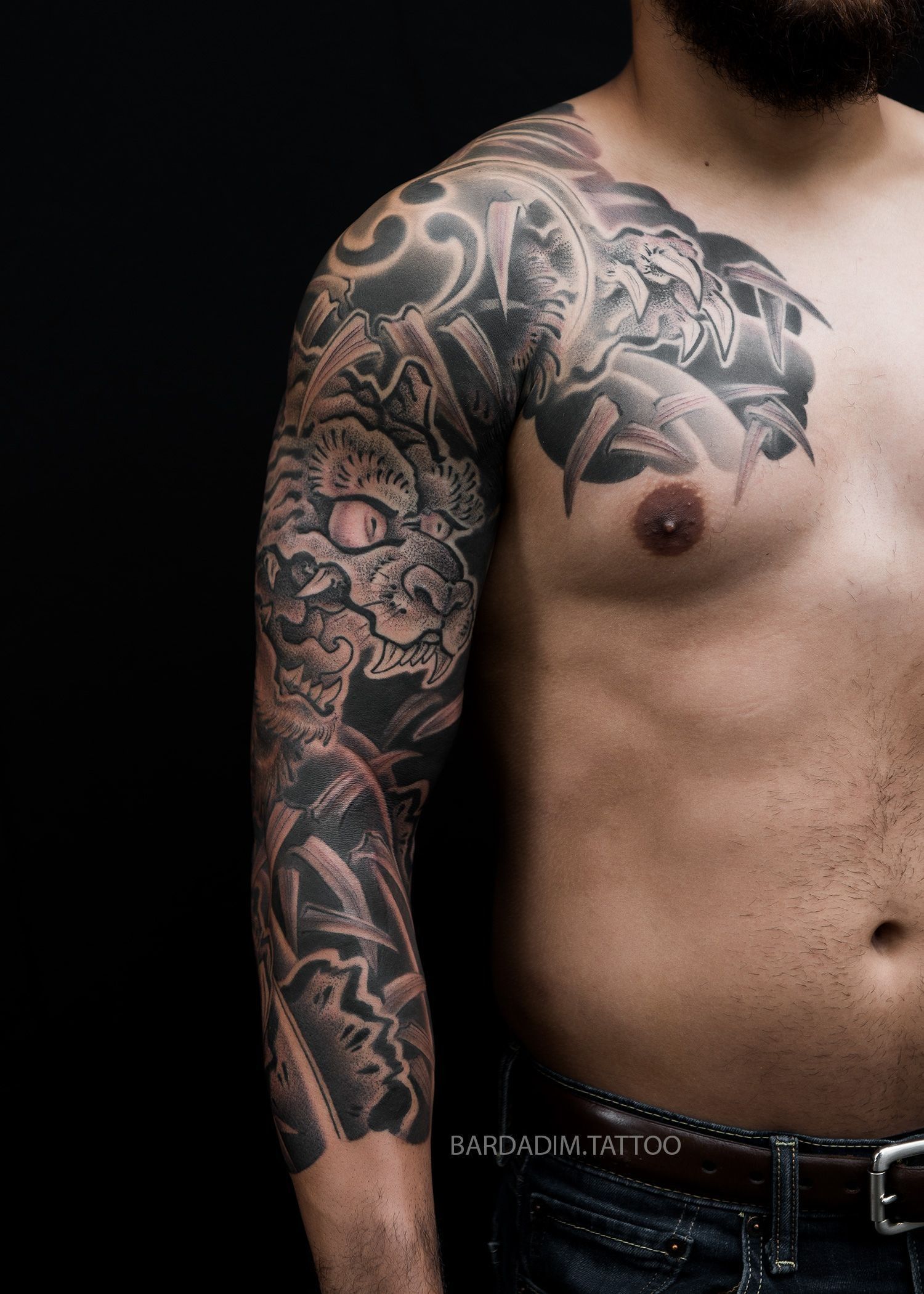 Traditional Irezumi 3/4 sleeve tattoo with tiger and Mitsu-Tomoe symbol by Bardadim Tattoo Studio