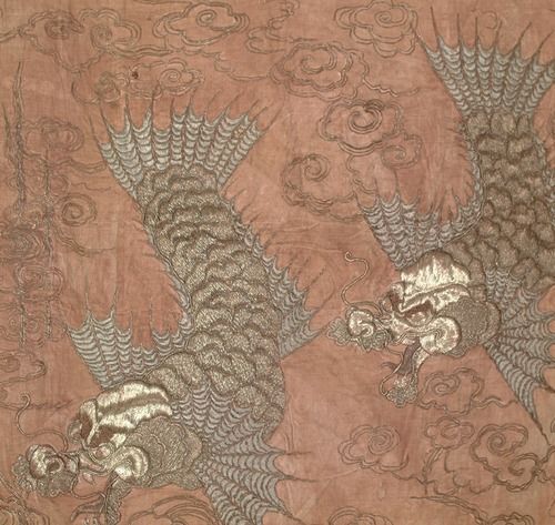 Two embroidered koi-dragons with metallic thread against a pinkish background with clouds kimono fabric