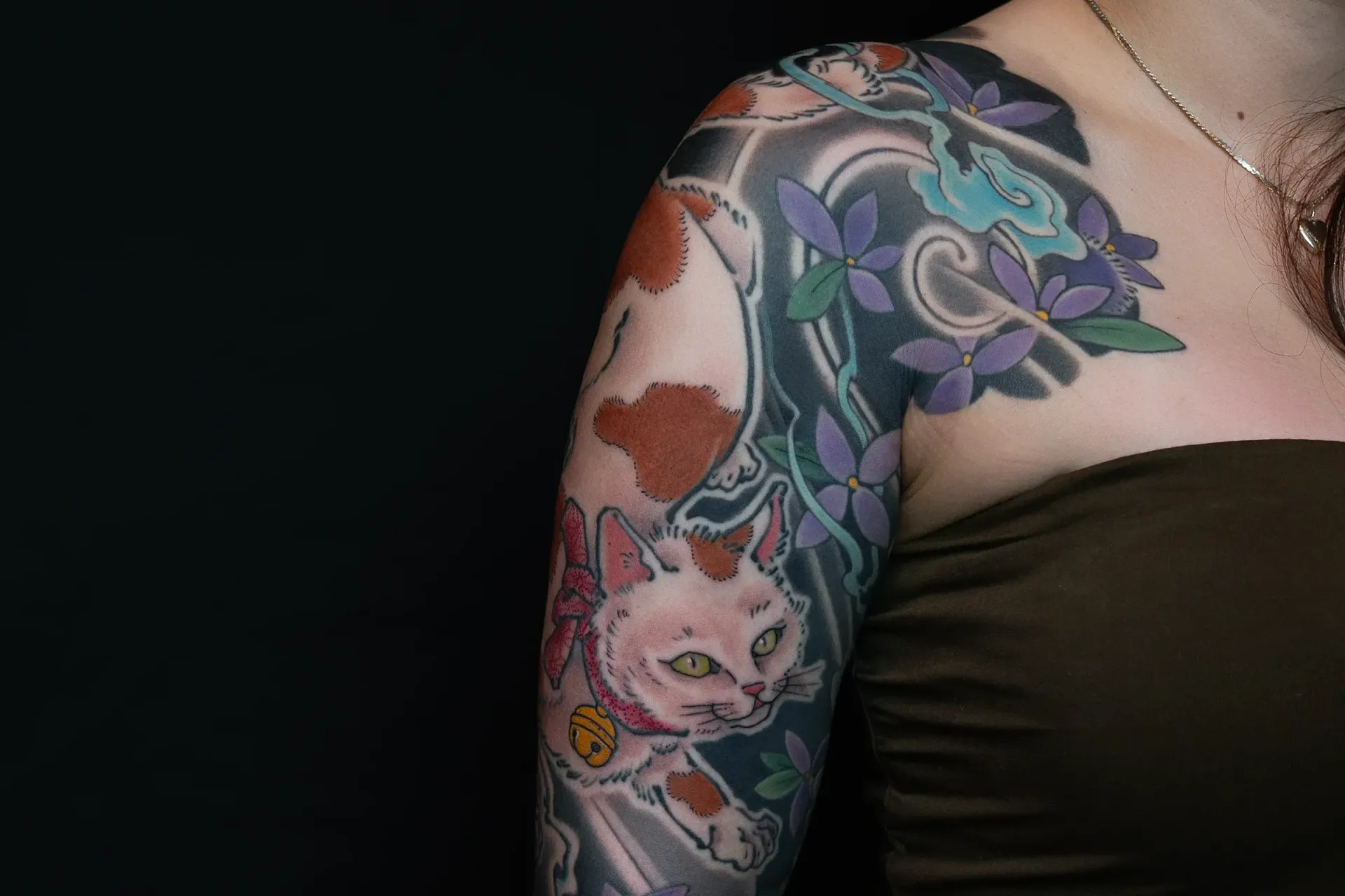 Complete Japanese full sleeve tattoo with twin monster cats, fireballs, and mountain hydrangea