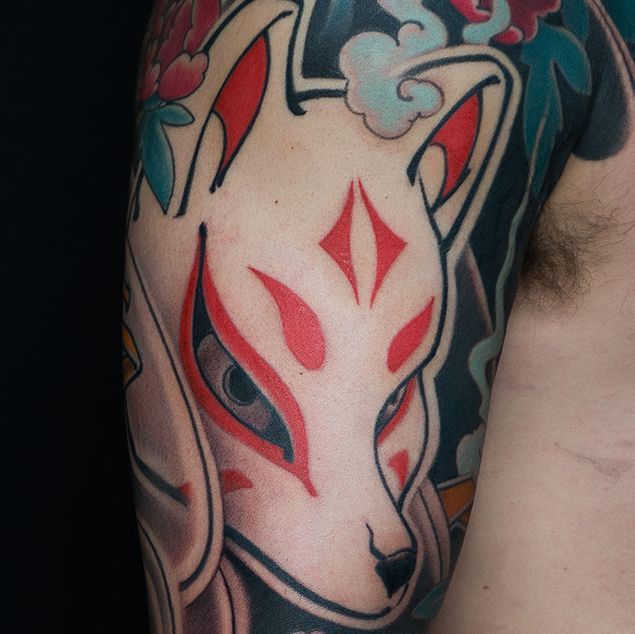 Japanese kitsune fox mask tattoo in traditional irezumi style