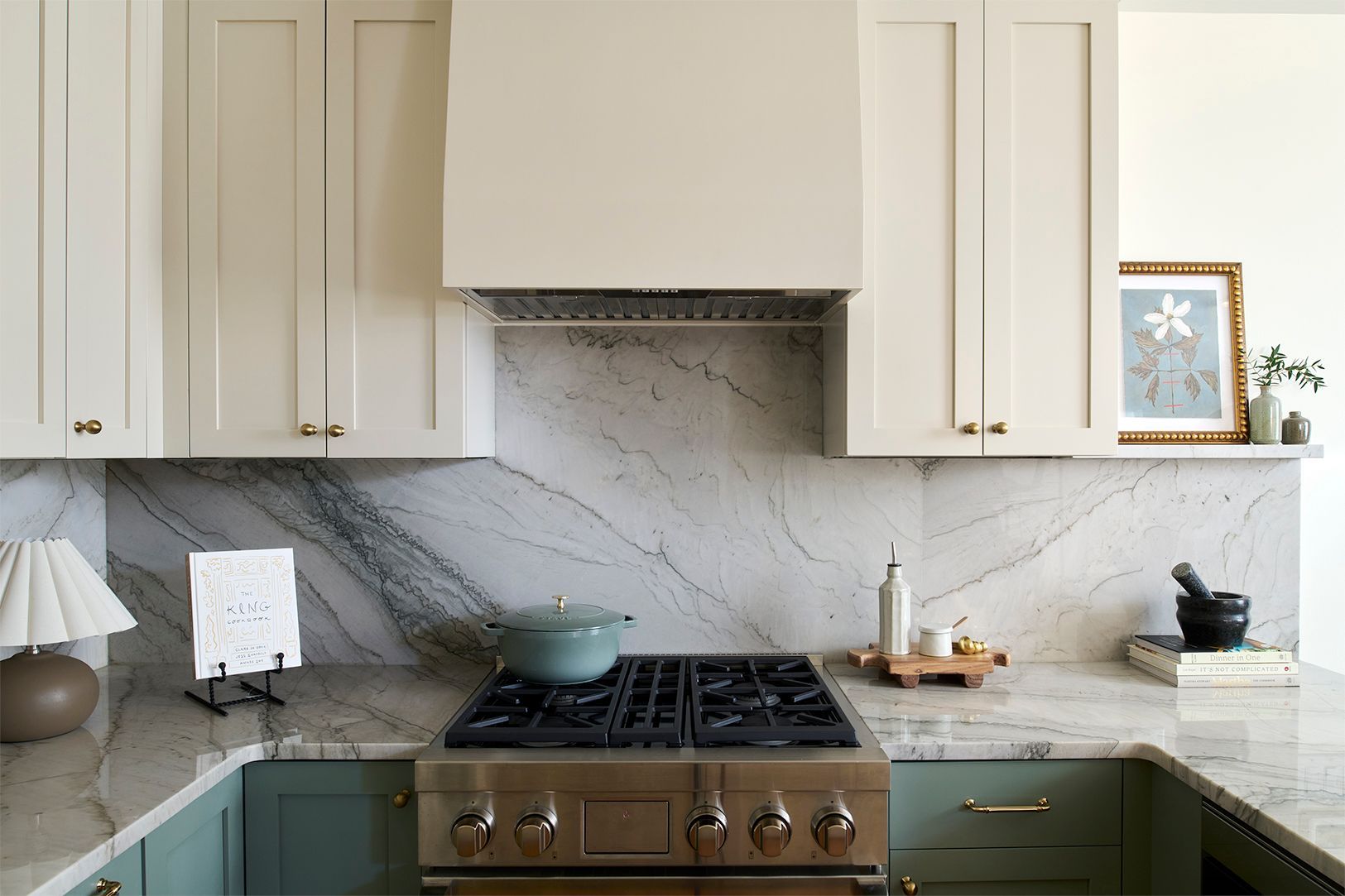 Two-tone kitchen with slab backsplash